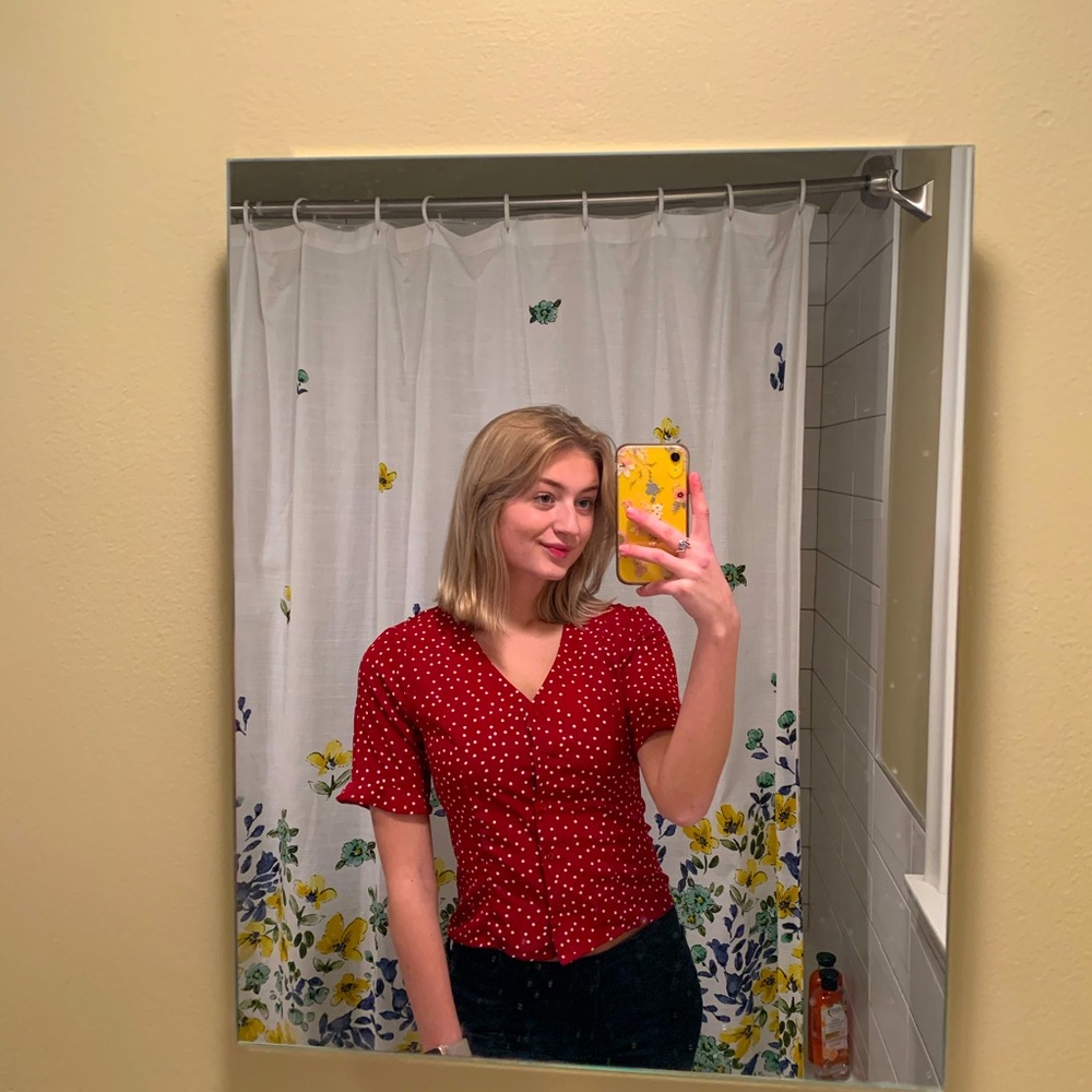 red polka dot shirt